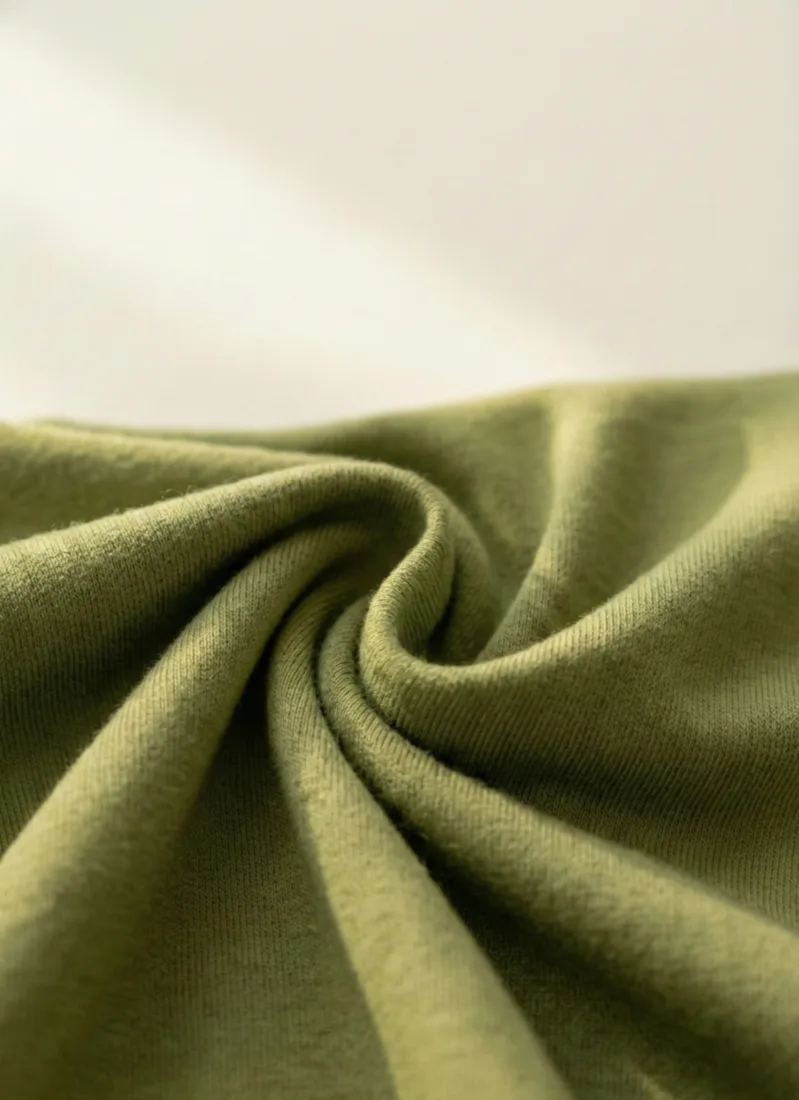 95% viscose from bamboo, 5% spandex. Breathable and lightweight, with 4-way stretch.
